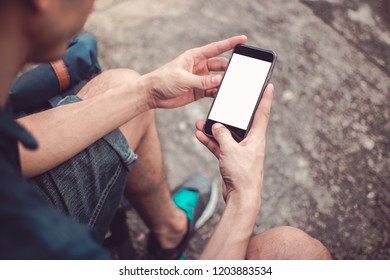 Man holding smartphone on hand with vintage tone. subject is blurred and noise. - Shutterstock ID 1203883534
