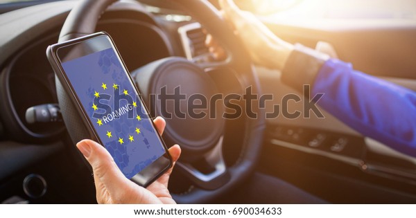 man holding\
smartphone on his car to see\
GPS