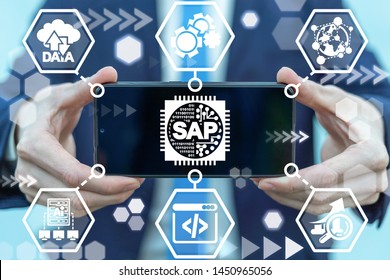 Man holding smartphone with sap micro chip icon on screen. SAP - Business process automation software. ERP enterprise resources planning system concept. - Shutterstock ID 1450965056
