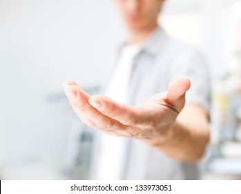 Man holding something on his hand