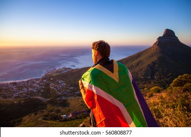 Man Holding A South African Flag Over Cape Town