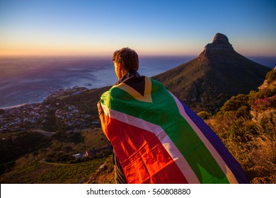 Man Holding A South African Flag Over Cape Town