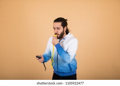 Man Holding Stop Watch And A Buzzer , In An Orange Background