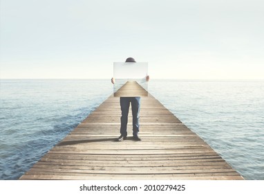Man holding surreal painting of a boardwalk, abstract concept - Shutterstock ID 2010279425
