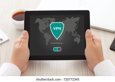 man holding tablet with app vpn creation Internet protocols for protection private network