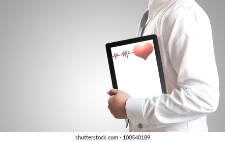 Man Holding Tablet PC With Red Heart And Pulse On Blank White Screen