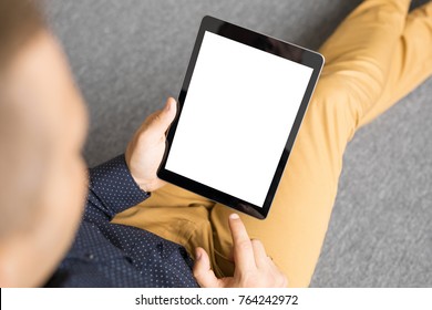 Man Holding Tablet In Vertical Position.