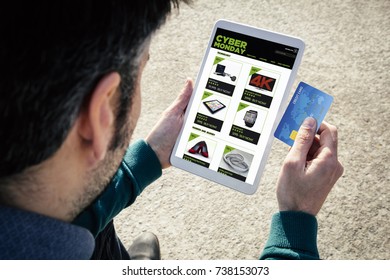 Man Holding A Tabletshopping On Cyber Monday With A Credit Card