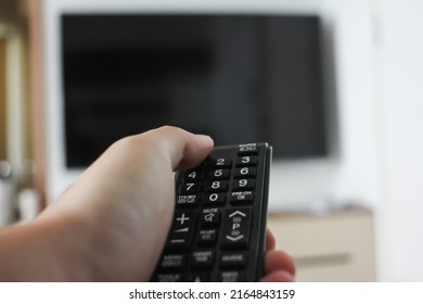 Man Holding Television Remote Controller Home Stock Photo 2164843159 