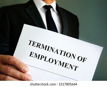 Man Is Holding Termination Of Employment Papers.