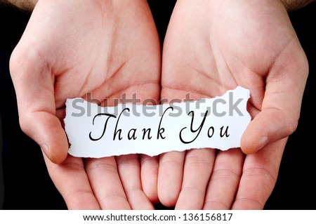Man holding thank you word in palm