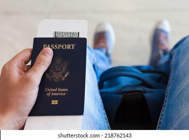 Man Holding Ticket And Passport 