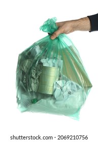 Man Holding Trash Bag Filled With Garbage On White Background, Closeup