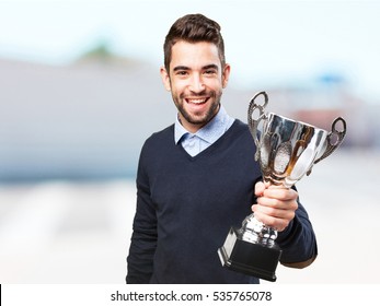 Man Holding A Trophy