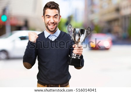 man holding a trophy