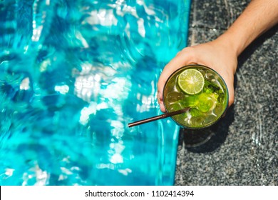 Man holding tropical mojito cocktail - Powered by Shutterstock