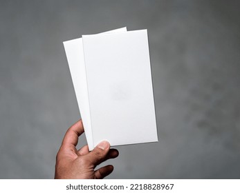 Man Holding Two White Cards Mockup Template