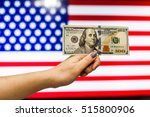 Man holding US Dollar bank note indicating market crash due to new US president with flag background