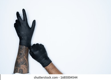 A Man Holding Variation Of Black Latex Glove, Rubber Glove Manufacturing, Human Hand Is Wearing A Medical Glove, Glove, Isolated