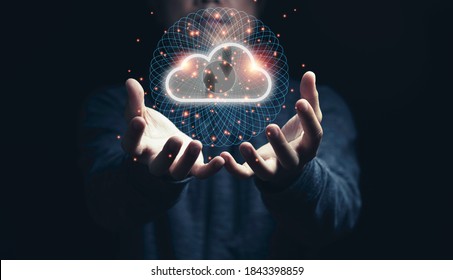 Man holding virtual cloud computing on hand with connection line.Cloud computing is system for sharing download and upload big data information. - Powered by Shutterstock