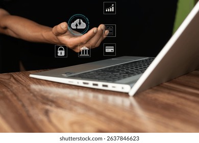 Man holding virtual cloud data icon on laptop