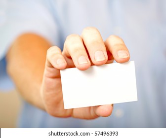 Man holding visiting card - Powered by Shutterstock