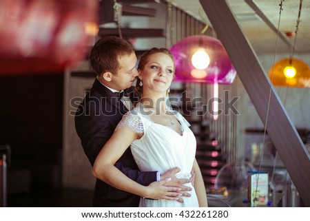 Man Holding The Waist Of His Gorgeous Wife Man Holding The Waist Of His Gorgeous Wife