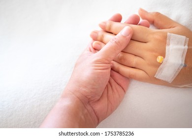 man holding women hand in hospital. women sick in hospital. People with medical concept. - Shutterstock ID 1753785236