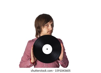 A Man Holds A Black Vinyl Record. Isolate On A White Background.