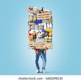 Man Holds A Box With A Huge Pile Of Food