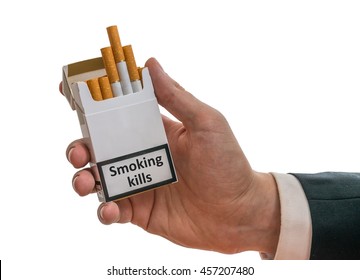 Man Holds Cigarette Pack In Hand With Warning Label That Says Smoking Kills.