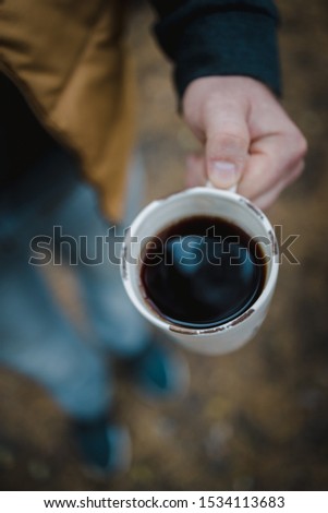 Similar – Senior Paar Hände gießen Kaffee aus der Thermoskanne.