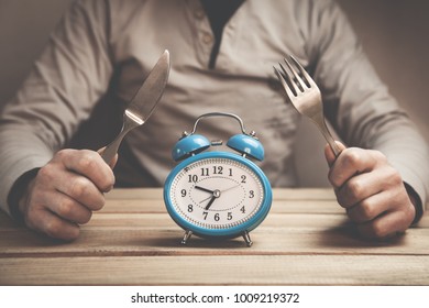 Man Holds Fork With Knife. Time To Eat.