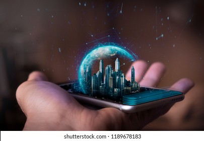 A man holds a futuristic phone in his hand, on which appears a futuristic metropolitan city with a holographic world. Concept of: business, connection, communication, people. - Shutterstock ID 1189678183