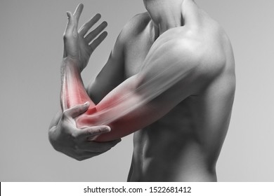 Man Holds His Elbow By The Hand. Pain Zone In The Arm And Bone Illustration