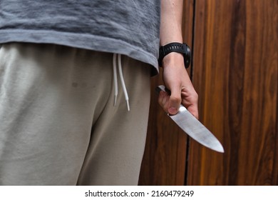 The Man Holds A Knife In His Hand. Concept Showing Violence Or Murder By Knife