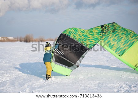 Similar – Image, Stock Photo Anonymous man holding wind turbine model on field against blue