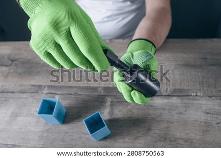 a man holds a puller in his hand