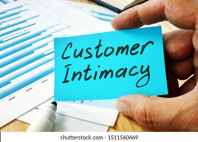 Man holds sign customer intimacy on the piece of paper. - Shutterstock ID 1511560469