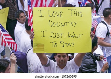 Man Holds Sign Saying 