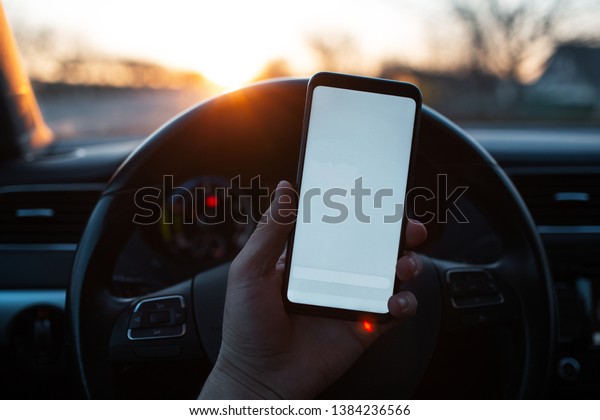 Download Man Holds Smartphone Mockup Car On Stock Photo Edit Now 1384236566 PSD Mockup Templates