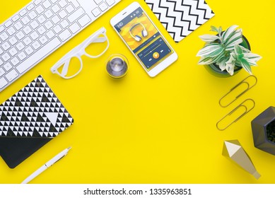 Man holds a tablet and looks at the screen. Mobile development. Innovational online businesses. Internet technologies. Trendy design. Geometry. Fashionable vibrant colors. Using a device. UX and UI.