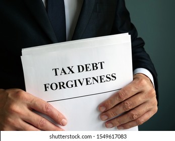 Man Holds Tax Debt Forgiveness Agreement.