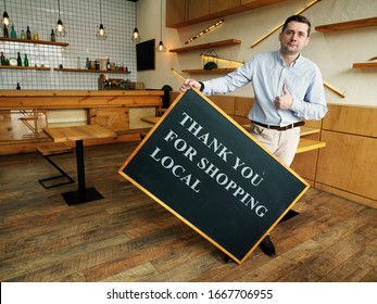 Man Holds Thank You For Shopping Local Board. Small Business Concept.