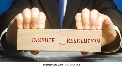 Man holds wooden puzzles with the words Dispute Resolution. Law and justice concept. Litigation, arbitration, mediation. ADR. Search for compromises. Lawyer services - Shutterstock ID 1679404144