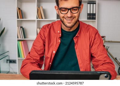 Man At Home Working With Computer Or Laptop