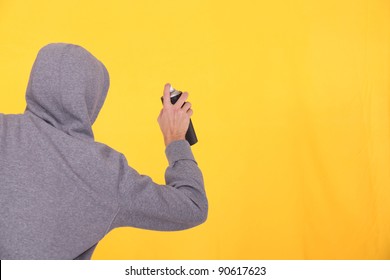 Man In A Hoodie Spray Painting