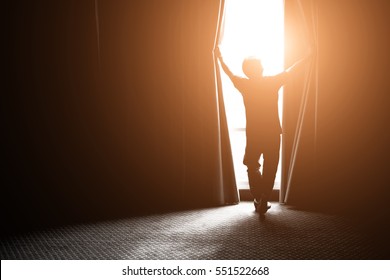man and hope concept . man opening window curtains - Shutterstock ID 551522668