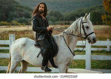 Man Horse Riding. Young Jockey Training His Horse For A Ride.