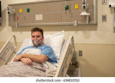 A Man In A Hospital Bed.